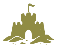 A sandcastle with a flag on top, sitting on a small mound of sand.