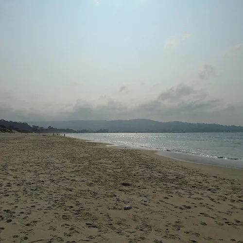 The wide sandy shore of Monterey State Beach on Monterey Bay