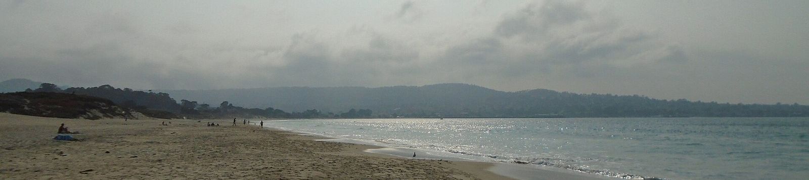 The wide sandy shore of Monterey State Beach on Monterey Bay